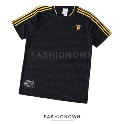 Manchester United 2025/26 Retro Pinstripe T-Shirt – Black & Gold